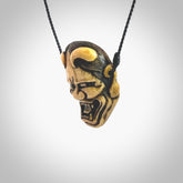 Hand carved Hannya mask Pendant. Made from Red Deer antler in New Zealand. Unique Hannya Play Mask necklace hand made from deer antler by master bone carver Fumio Noguchi. Spectacular collectable work of art, made to wear. One only pendant, delivered to you with express courier.